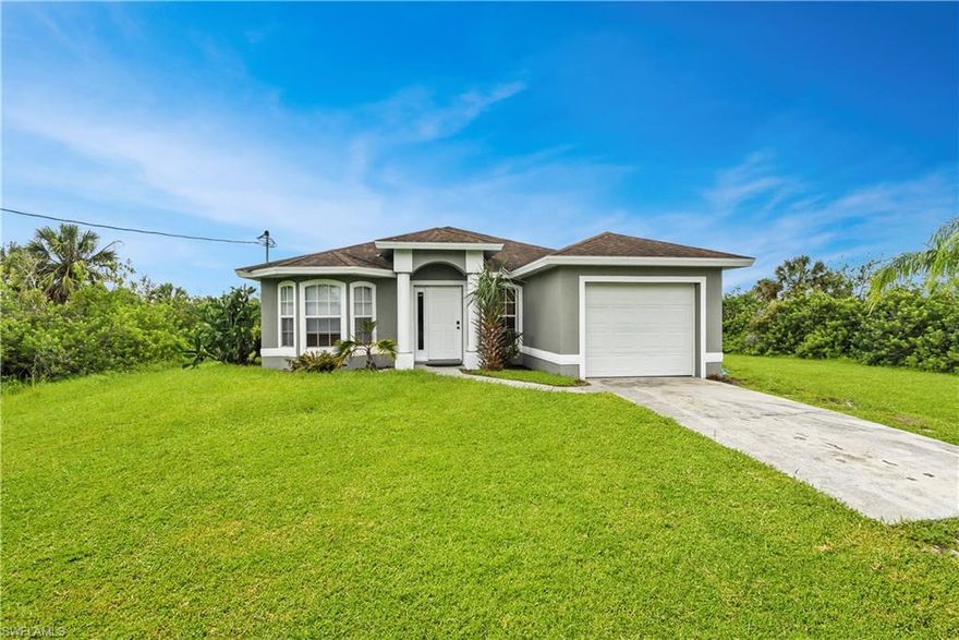 Great opportunity to own a home with an Old Florida setting! Situated on almost 2 1/2 acres in the growing NW part of Naples, this 3 bedroom home has a traditional split bedroom floor plan and offers over 1,100sf of under air living space. The kitchen has dual entry (one from each side of the home), a service window to the lanai, and all appliances are only 5 years old. A new Carrier a/c unit was installed in 2015 and features a UV light along with a photocatalytic oxidation PCO PhotoMax which improves the air quality immensely. Offering $1,500 flooring allowance.  There is plenty of room to or all of your toys, and definitely enough land to add a work shed/detached garage, a pool, and/or fire pit area if desired. The land backs up to a canal and is partially cleared (front end). Located just off of Immokalee Rd with easy access to I-75, and close to lots of shopping & dining options. You will love having all the conveniences of city life while enjoying the quiet country life as well!