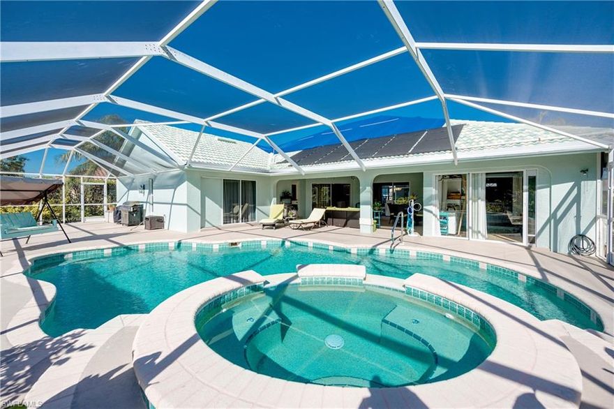 The home is located on a quiet cul-de-sac street fifteen minutes to beaches, close to shopping and emergency services, in the best school zone in Collier County, and two convenient community entrances with thirty-six holes of golf in Imperial Golf Course Country Club. The HOA fees for this peaceful family-oriented community are among the lowest in the area. This gem offers an open concept floor plan with 15' vaulted ceilings and knock down finishes. Impress your guests with the granite countertop kitchen and new stainless steel appliances, including bar area. All bedrooms offer walk-in closets and the hobby room is fitted with an oversized double folding door closet, while the bathrooms provide luxurious walk-in tiled showers. The sun drenched, southern facing Lanai boasts a custom swiming pool and jacuzzi spa with solar heating and cold water shower. The Lanai is enclosed by mature landscaping with fruit trees. There is an extra 5' x 13' golf cart garage for storage space located on the side of the house. To provide privacy between the residents all the interior walls are insulated for noise reduction. A new roof with a $80,000 value will be installed by the Seller in February!