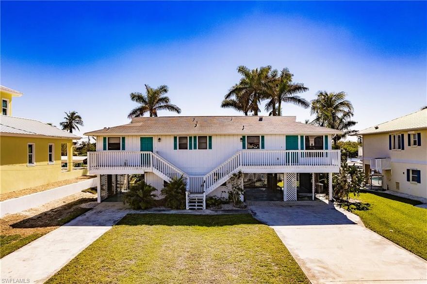 THIS Listing is for Land Value … GREAT LOCATION,PERFECT WATERFRONT LOT, & Beautiful Views  !!!! GREAT TO TEAR DOWN and BUILD NEW Dream or Spec Home!!! Currently set up as a Duplex, but the Value is in the Waterfront Lot with Southern Exposure and Wide Intersecting Canal with DIRECT Access to the Gulf. This home can be renovated and would make a great Duplex, but also a perfect spot to tear house down and Build New. Tons of New Construction homes on the block and in this area. Selling As is, Seawall needs to be replaced and Home is in need of work. We have plans of Models of homes that can be built here. Would make a Great Home or Air BNB. Great Location and close to everything Bonita Springs has to offer from Restaurants, Shopping, Boating Activities, Kayaking and More….