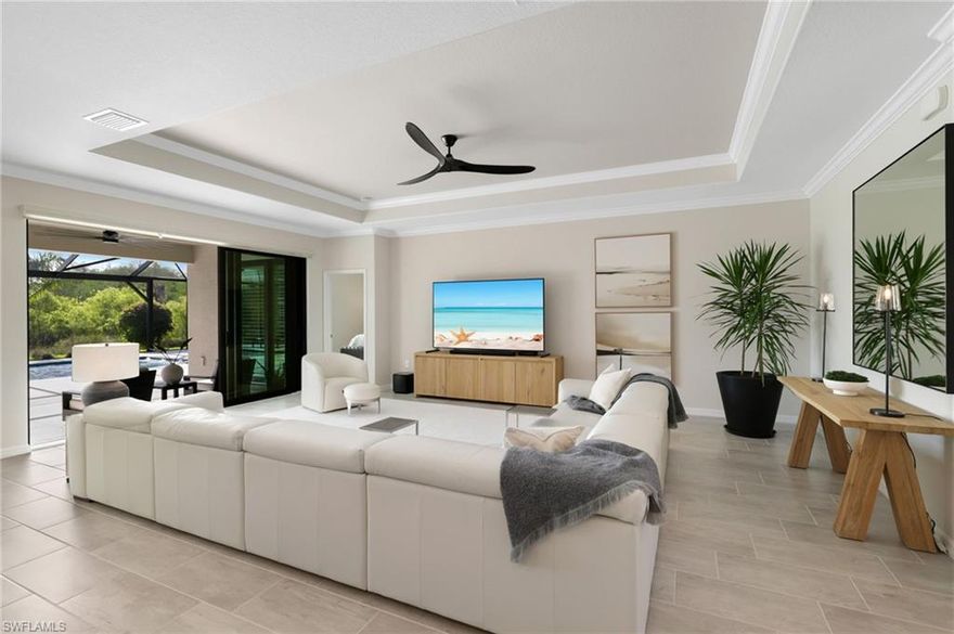 One or more photo(s) has been virtually staged, AI generated or rendered.  Experience the epitome of Florida living in this immaculate modern single-family Summerville home located in the coveted community of The Place at Corkscrew. Boasting 2,445 square feet of living space, this custom 3-BEDROOM PLUS DEN, 3-BATHROOM pool home seamlessly combines style, comfort, and functionality to suit any lifestyle. Upon entry, you are greeted by a soft, neutral color palette and sleek kitchen featuring stainless steel appliances, white cabinets, an oversized  island with granite countertops, and a walk-in pantry with custom shelves. The open layout flows into the living and dining areas, both bathed in natural light. From the TILE FLOORING to the PLANTATION SHUTTERS and upgraded lighting fixtures, every detail exudes luxury and sophistication. The highlight of the home is the CUSTOM SALTWATER POOL surrounded by Shell Stone tile and a PANORAMIC (no see-um) SCREEN that offers serene views of the vast preserve. With an EXPANSIVE PATIO area for gatherings, this 15 x 30 foot pool features a luxurious 15 x 8 foot sun shelf, designed and installed in 2024 to elevate your outdoor living experience. The primary suite offers a private sanctuary with a large bedroom, access to the lanai, DUAL CUSTOM BUILT WALK-IN CLOSETS, and a spa-like ensuite bathroom with dual sinks and a WALK-IN SHOWER WITH FRAMLESS GLASS. Two additional bedrooms located at the front of the house, one with its own ensuite bathroom, provide ample space and privacy for family or family. The office with FRENCH DOORS offers a quiet retreat for work or relaxation. Other notable features include IMPACT WINDOWS AND DOORS, double door entry, custom lighting and fans, new Bosch dishwasher, REVERSE OSMOSIS, laundry room with utility sink and extra storage cabinets, a 3-CAR GARAGE with insulated doors and attic, motorized blinds in the greenroom, keyless entry, WHOLE HOME WATER FILTRATION SYSTEM, Ring doorbell and cameras, and gutters. Set on a generous 0.24-acre lot with an East rear preserve views, this home is perfect for enjoying the Florida outdoors. Whether lounging by the pool, hosting gatherings, or unwinding in your own private sanctuary, this home offers it all. 

The Place at Corkscrew community amenities include an indoor/outdoor restaurant/bar, resort-style pool, water slide, 40-person spa, splash pad, 2-story fitness center, playground, tennis and pickleball courts, bocce ball, basketball court, and dog park. With low HOA fee, no flood zone and a prime location near shopping, dining, entertainment, RSW Airport, FGCU, and beaches, this home in Estero is a true gem for those seeking the ultimate Florida lifestyle.