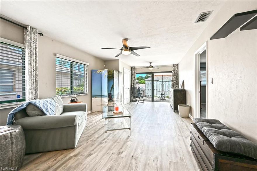 Nicely updated! This 2 bedroom 2 bath end unit attached villa features upgraded laminate floors, updated bathrooms, impact windows and sliding glass doors. The unit also features a spacious fenced in patio perfect for entertaining making this feel like a true Villa. Polynesian Villas is located just minutes from the beach and walking distance to local restaurants and shopping.  Great opportunity for the first home buyer or rental property.