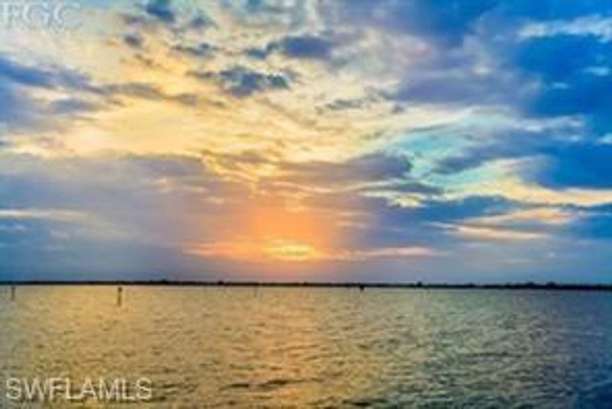 No expense spared.  Professionally remodeled 3 bedroom 2 bath 1700+ sf condo with spectacular river views and of course amazing sunsets.  This home offers an open floor plan with a modern large working kitchen and bath designs; new high end stainless steel appliances; all hard floor surfaces (no carpet to clean); designer paint; custom lighting and new impact doors and windows.  River views from all living areas and there is a large screened lanai with outside seating for indoor/outdoor living.  Two separate living rooms and an open kitchen to interact with guests.  An entertainer's dream.  All this and many amenities (pickleball, tennis, exercise room, clubhouse, and a  full social event calendar).  Plus the convenience of being walking distance to Downtown Ft Myers and the Edison Ford Estates as well as numerous restaurants and shopping.  There are boat docks and Pinchers Restaurant located next to the community as well. Schedule your showing today!!  This one won't last.