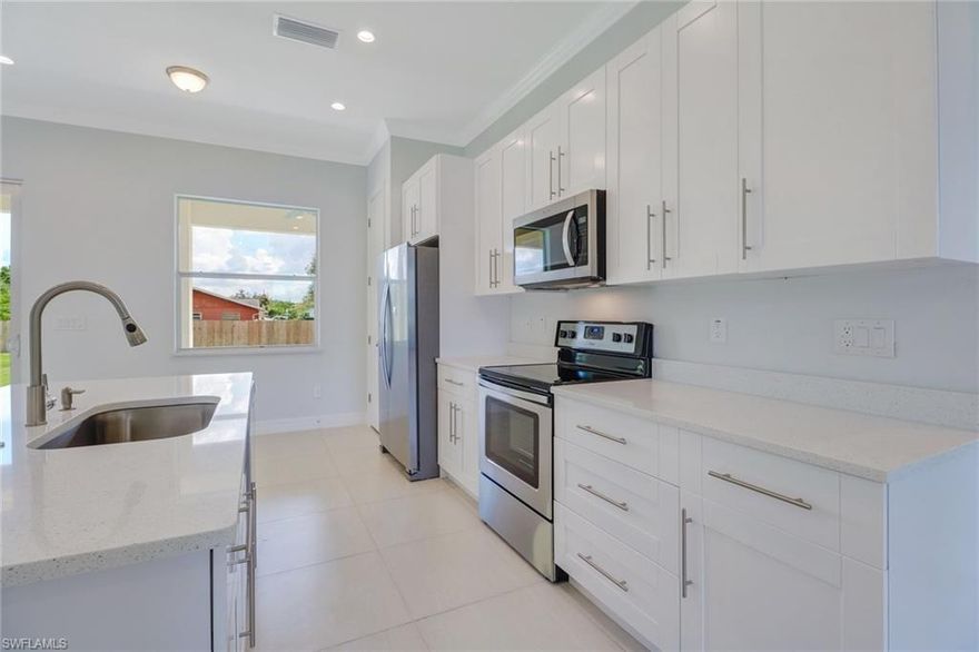 Looking for a home with high quality construction at an affordable price? Then look no further! Brand New Construction in a great neighborhood of Bonita! Best of all…No fees No restrictions!  As you enter you will notice the attention to detail. Open floor plan with plenty of light throughout this home that will make you fall in love! 10’ ceilings,  8’ doors, tile throughout, a beautiful kitchen with an island, soft close cabinets, quartz countertops, stainless steel appliances and best of all, your own bar entertainment area with a wine cooler! The master bedroom will drive you crazy!  It features trey ceiling, dual walk-in closets, and a large master bath with Quartz countertops and a beautiful shower with custom tile. This home is ready with Impact resistant windows and doors.  My favorite feature is the second master with it's own wet bar which has a separate entrance on the side making it a perfect in-law suite or room for a family member. This home offers over 2,000sqft under air, 4 bedrooms, 3 baths with 2 master suites. Close to everything Bonita has to offer! Minutes to Bonita Beach, 15 mins to Coconut Point, and best of all, close to I-75!