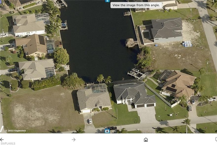 This is one of the few remaining oversized Corner Lots with Gulf Access in the South West of Cape Coral. Nestled in a quiet neighborhood with nice Pool Homes and perfect manicured lawns with no drive through traffic. All Assessments paid. The Gulf Access corner triple lot provides the opportunity to the prospective Owner to build a spacious Custom Pool Home with a 3 or 4 Car Side Loader Garage and four or five Bedrooms and Baths depending on which Style you choose for your new Florida Residence. Enjoy the Views down an extra wide, large salt water canal or use your own boat to explore the Florida Lifestyle at its best. Rare chance to fulfill your own ideas for a Florida Dream Home on an oversized Corner Lot still reasonable priced.