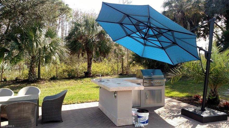 Welcome to Lot 15 at Golden Palms Luxury Motorcoach Resort — a rare oversized preserve lot offering privacy, beauty, and endless potential.

Tucked along a protected natural preserve, this exceptional property delivers a peaceful, private setting surrounded by lush, upscale landscaping that has been meticulously maintained by the owners. Every detail of the vegetation and grounds reflects pride of ownership and thoughtful care, creating a truly serene outdoor environment.  Beautiful Outdoor Kitchen & Entertaining Space with Preserve Views

Enjoy outdoor living at its finest with this thoughtfully designed open-air kitchen and patio, perfectly positioned to capture serene preserve views and lush tropical landscaping. The space features a built-in stainless steel grill and refrigerator with ample prep area and a solid surface countertop, ideal for hosting and entertaining, creating a true outdoor dining experience alongside a spacious seating area set on attractive brick pavers. Surrounded by mature palms and natural greenery, this private setting offers both tranquility and a true Florida resort-style atmosphere.

Whether you’re grilling, relaxing, or entertaining guests, this outdoor kitchen area is a standout feature that enhances the lifestyle and livability of this exceptional property.

This oversized RV lot provides abundant space to accommodate your Class A or Super C motorcoach, additional vehicles, or a stacker trailer — while still leaving plenty of room to design and build your custom coach cabana, outdoor kitchen, pool, or private retreat. Whether you’re ready to build now or prefer to enjoy the open space as-is, Lot 15 offers the flexibility and canvas to bring your vision to life.  Fully improved with infrastructure in place—simply bring your plans and start building your dream cabana.  At Golden Palms, your dream Cabana is built to your liking, and up to 840 sq ft

Golden Palms is a premier, gated, and pet-friendly luxury motorcoach resort known for its welcoming atmosphere and resort-style amenities. Owners enjoy access to a beautifully appointed clubhouse, resort pool and spa, sauna, fitness center, and a full calendar of social activities. Outdoor enthusiasts will love the pickleball courts, fishing pier on the 22-acre lake, kayaks, paddleboats, gatherings, and more.

Ideally located in Fort Myers, you are just minutes from dining, shopping, golf, RSW International Airport, spring training stadiums, and Southwest Florida’s world-renowned beaches.

Whether you’re seeking a seasonal escape or a full-time home base, Lot 15 offers the perfect blend of privacy, luxury, and opportunity.

Build your dream. Park in paradise. Welcome Home.