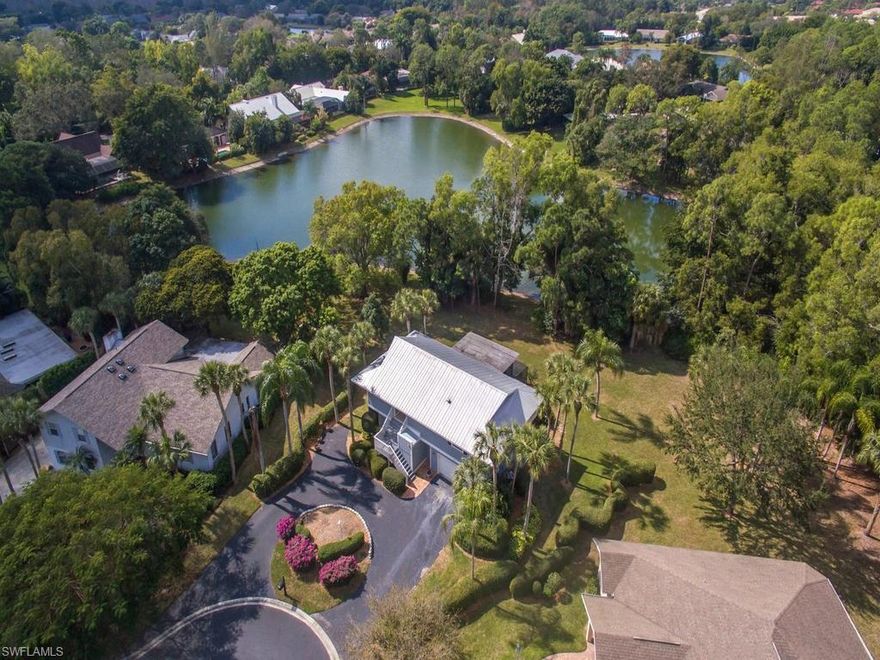 H.11660 - Tucked on the end of the cul de sac overlooking a clear lake and preserve, this 4 bedroom, 3 bath home has Charm and Distinction. Totally unique, expansive yet a cozy home with open space, polished woods, wonderful decks and viewing areas. This exclusive setting is stunning, centered on a large pie shape lot, under mature Oaks and tropical Palms; 441 Widgeon is an amazing house!! With two living floors it's over 2100 square feet, boasting polished hardwoods, metal roof, new paint and sharp white trim around the viewing balconies.The yard is taken care of by the association. The home has a great open room to congregate and mingle then plenty of relaxing quiet spots to find to relax alone. Kitchen and all three bathrooms have been REDONE! updated bronze and tan granite counter-tops, decorative cabinet handles, spiral staircase,  study or work shop, two car garage and below ground pool.