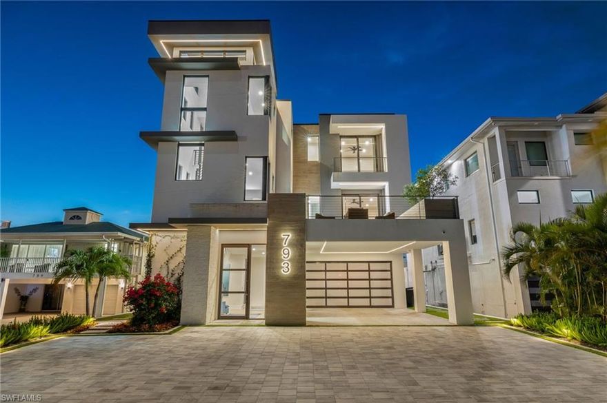 This is 793 San Carlos Drive—less a house and more a waypoint on the map of a life well-lived. A modern coastal refuge tucked into the salty heartbeat of Fort Myers Beach, where the air smells of sunburnt afternoons and the tide keeps its own kind of time. It’s built for those grand, cinematic sunsets that spill across Matanzas Bay, the kind you watch in silence because words just get in the way. Built for poolside barbeques that run late, for Florida winter nights when conversation drifts like smoke, for slow bike rides to seafood joints where the fish are still telling stories from the Gulf. 

Inside, two primary suites and four guest rooms, all en-suite, make it the sort of place where family converges, friends linger, and nobody feels like they drew the short straw. It’s a home that doesn’t just host memories; it cooks them slowly, like something that gets better the longer you let it simmer.


The kitchen is the soul of it all. Mid-century esque meets modern, a space begging for simple ingredients, good knives, and better company. From here, you can watch the world wander by on the water while you stir, chop, taste, and exist—exactly as you are. From the terrace, the view opens in soft, deliberate layers—first across untouched Grayson Island and its protected bird sanctuary, then out toward the distant shimmer of Fort Myers Beach’s skyline, with the Sanibel Causeway stretching quietly along the eastern edge of the horizon.


Up top, the dual primary suites hide away like little sanctuaries, each with wide-open views that remind you why people chase the horizon in the first place. Everything inside has been curated with a sharp, contemporary eye—furnishings that feel effortless, textures that feel intentional. It’s the kind of place you can step into and immediately exhale. Turn the key, and you’re already living the life.


With Control4 automation, hidden surround sound, a Tesla charger, Generac generator and a build engineered to shrug off coastal moods, this home blends luxury with durability. A place made for people who appreciate beauty—but also know that the world is imperfect, unpredictable, and worth experiencing anyway. The water keeps its rhythm. The sunsets write their own script. All that’s missing is someone to call it home. Perhaps that’s you. Schedule a showing today.