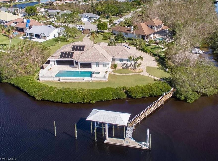 LUXURY CUSTOM DESIGNED WATERFRONT HOME ON A UNIQUE 1 ACRE + CORNER LOT WITH PRIVATE FLOATING BOAT DOCK FOR A UP TO 80’ YACHT and an additional covered boat dock with lift. Located in the highly alluring Deep Lagoon Town & River area with an unobstructed view of the spectacular Southwest Florida sunsets. 

The grand entry doors lead to soaring ceilings, vast amounts of space, & breathtaking waterfront views. The 3 BR/Den, 3 1/2 BA residence is fully furnished, has quarts, granite and marble countertops, premium hardwood floors and is finished off with custom wood cabinetry.
The expansive living room incorporates a 107’ projection screen.
Beautiful overflow saltwater 45’x20’ pool and attached jacuzzi, solar + electric heated. Outdoor sitting area with fireplace topped by an oversized flatscreen TV, flickering gas lanters framing the pool area, spacious outdoor kitchen with grill, fridge, sink, double stove top burner. All overlooking the heavenly outlook. 
Last but not least, park your luxury cars in the climatized 4 car garage.
INTERESTED? Schedule your private showing TODAY.