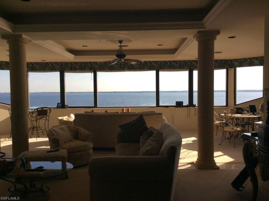 Fall in love with this stunning, Riverfront Penthouse on a cul de sac, with 360 degree views of the intracoastal and miles of Cape Coral and its canals that will take your breath away! Spectacular, one of a kind condo, entire 8th floor, keyed, PRIVATE access to your home's foyer. HANDICAP ACCESSIBLE with large roll in shower with steam mist option. 2 separate balconies, west-facing for gorgeous sunsets, 2 CAR ATTACHED GARAGE & locked storage room.  Spacious, custom kitchen, top of the line appliances & Brittian cabinets. Smooth counter tops, breakfast bar, and wet bar, great for entertaining. 3BRs, EACH WITH THEIR OWN FULL BATH!   Powder room, fireplace, columns, built-ins, plenty of closet space, Lg MBR with walk in closet & view of the river from bed.  2 newer AC units & humidistats.  Appeals to the discriminating buyer who wants something architecturally special. Jaycee Park is next door for walking, picnicking, fishing, enjoying a Farmer's Market, Hoedown, or family carnival! BOAT DOCK #11 WITH NEW 10,000 LIFT AVAILABLE AT ADDITIONAL COST.  HOA has been stable for many years.  Good reserves.  SEE VISUAL TOUR.