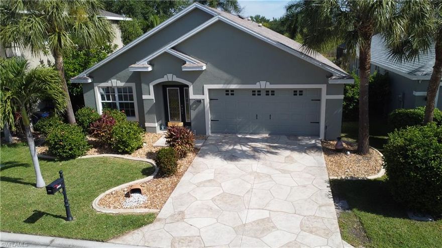 Welcome to Danforth Lakes—a standout community offering exceptional value with low HOA fees, no city taxes, no CDD, and no flood insurance requirement.
This well-appointed home features 4 bedrooms, 2 bathrooms, and a 2-car garage overlooking private tranquil preserve views.  The back patio is partially covered/ screened and perfect for unwinding.  The entire back yard is already fenced and well set up for both pets and children. Inside, you’ll find soaring vaulted ceilings, crown molding, and a tasteful mix of tile and wood flooring. The kitchen and bathrooms have been thoughtfully updated with modern finishes, including granite countertops.  The roof was replaced in 2020, the exterior was just painted in 2025, new decorative fencing installed in 2025 & the front door was just replace recently for added peace of mind. Danforth is conveniently located off Daniels near I-75, RSW Airport, spring training facilities as well as tons of shopping & dining options within 5 minutes. Enjoy a relaxed, amenity-rich lifestyle with access to a fitness center, beautiful community pool, tennis courts, playground, and clubhouse. This fabulous home & community delivers the ideal combination of location, lifestyle, and value.