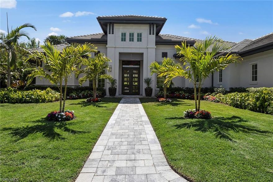 Experience unparalleled elegance in this exquisite estate home, ideally in the prestigious community of Quail West. Offering an exceptional blend of modern design and timeless sophistication, this meticulously crafted residence features four bedrooms, five baths, and a thoughtfully designed floor plan that seamlessly integrates indoor and outdoor living. With 4,229 square feet under air, this home is designed for grand entertaining and intimate gatherings. A chef’s dream, the gourmet kitchen boasts dual islands, two sinks and a professional-grade Viking six-burner gas range with dual ovens. Custom cabinetry, refined ceiling details and a fully equipped wet bar elevate the living spaces, while built-ins in the office and living room add function and style. The expansive lanai, enhanced with electric screens and hurricane shutters, offers a serene retreat with a fireplace, a fully equipped outdoor kitchen, and breathtaking views of the resort-style pool adorned with striking fire bowls. The large, fenced-in yard ensures privacy, creating an idyllic setting for relaxation and entertainment. Designed for the discerning homeowner, this estate includes an attached two-car garage, a detached two-car garage, and a climate-controlled flex space, formerly a one-car garage, ideal for a music studio, gym or golf simulator. In Quail West, one of Naples distinguished country club communities, residents enjoy access to an extraordinary array of amenities, including a 70,000-square-foot clubhouse, two championship golf courses, premier tennis and pickleball courts, a lap pool, bocce courts, and multiple indoor and outdoor dining venues. A grand ballroom provides an opulent setting for unforgettable gatherings. Offering a lifestyle of refinement and exclusivity, this extraordinary residence is a rare opportunity to own a masterpiece in one of Southwest Florida’s sought-after communities. Schedule your private showing today.