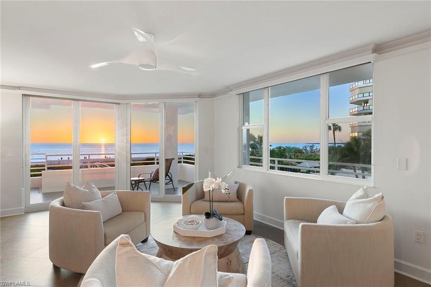 Located in Somerset of Marco, this turnkey-furnished corner beachfront condominium offers 1,672 air-conditioned square feet, a wraparound terrace, western exposure and sweeping Gulf and sunset views. This unique two-bedroom, two-bath residence features a reconfigured floor plan designed to expand the living area and emphasize the beach views. Impact glass throughout, large-format tile flooring and an open layout fill the interior with natural light. The kitchen opens seamlessly to the dining and living areas and is finished with custom cabinetry, stainless steel appliances, generous prep space and bar seating. Expansive glass and sliding doors draw in the beachfront setting, while the wraparound terrace creates an inviting extension of the living space for dining, relaxing and sunset views. Additional highlights include a spacious guest bedroom and an in-unit washer and dryer. Offered turnkey furnished, the residence is ready for immediate enjoyment or rental use. Somerset is a gated beachfront community with direct beach access, two pools, tennis and pickleball courts, a fitness center, barbecue areas, a library, social room and on-site management. Near Marco Walk Plaza, this residence is close to dining, shopping and island conveniences. Weekly rental flexibility offers added appeal for both investors and end users.