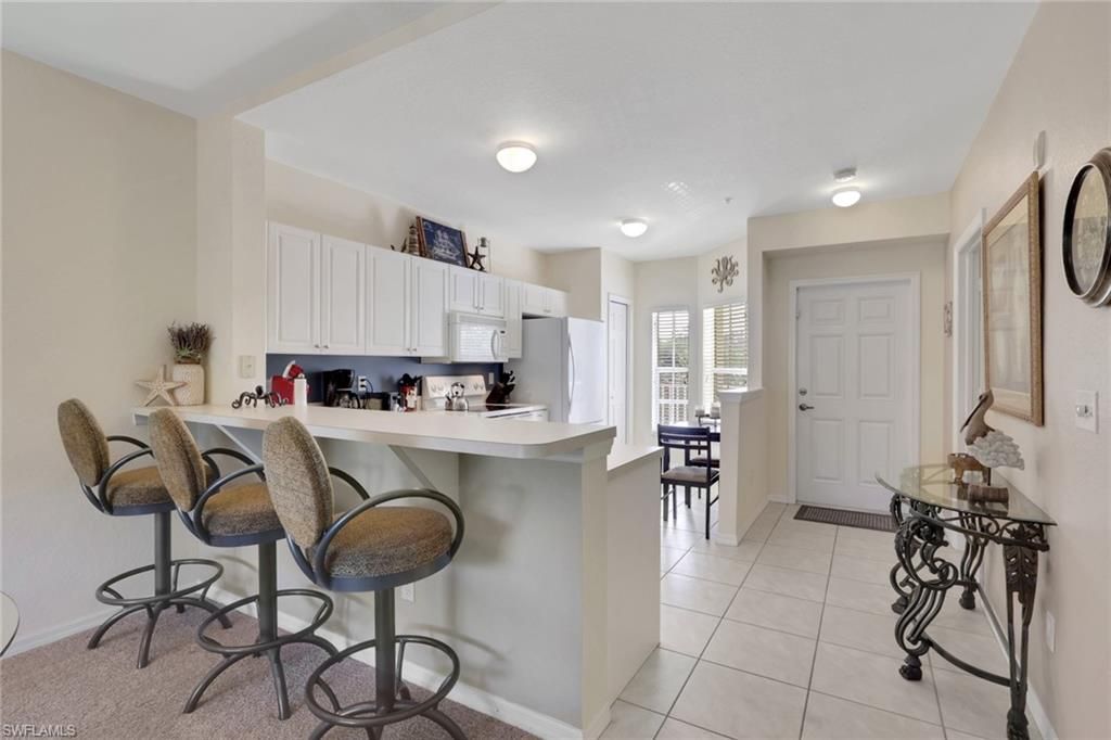 Photo of 9175 Celeste DR #303, NAPLES, FL 34113 (MLS # 226015067)