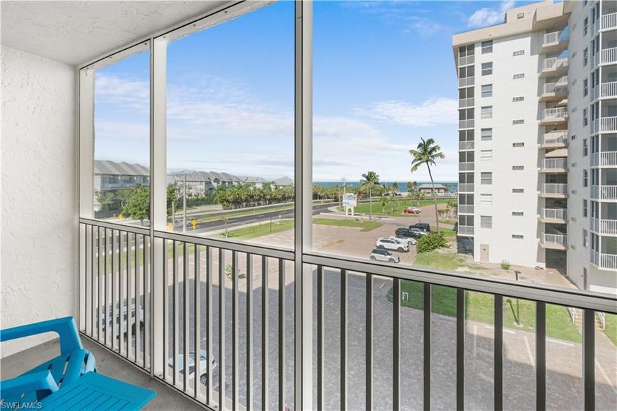 Gulf-view opportunity with strong rental income potential! This fourth-floor unit in Building 5 is ideally positioned to capture beautiful Gulf views and coastal breezes, offering an open and inviting layout designed for both comfort and functionality sleeping up to 4 guests. The bright kitchen features white cabinetry, all-new appliances, tile flooring, and a seamless flow into the living and dining areas, complemented by warm wood-look flooring beyond. The spacious sleeping area provides a comfortable, beach-inspired retreat, while the clean and well-maintained bathroom offers classic finishes. The enclosed balcony delivers an elevated vantage point overlooking the Gulf and surrounding community—perfect for enjoying sunsets and coastal breezes. Currently in a rental pool with excellent short-term rental flexibility, this property presents a turnkey investment or personal getaway opportunity. All assessments have been paid, providing added value and peace of mind for the next owner. Ideally located directly on Bonita Beach Road, just minutes to the sugar-sand beaches of the Gulf, as well as dining, shopping, and entertainment. A rare opportunity to own a proven income-producing property with views, location, and strong rental appeal.