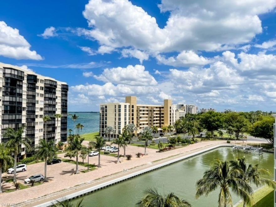 PENTHOUSE! Top floor corner unit CASA MARINA!!  AND, YES, THIS VIEW HAS THE SUNSETS EVERYONE LOVES!!  Wow views of Estero Bay from this 5th floor 2 bed / 2 bath condo! Views include expansive bay view, canal for dolphin and manatee visits, and a view of the gulf from your kitchen and dining area!  Oversized  for this building, you'll enjoy the almost 1,300 square feet with extra wide under-building deeded parking spot. Kitchen is completely reconfigured providing a modern open floor plan with island, Corian counters, bar seating, pantry, lots of storage and separate dining area with special effects lighting! NEW washer/dryer 2019 (Located in closet on lanai) and dishwasher in 2019.  Electric shutters on the lanai, all other windows have manual shutters.  Start enjoying the amenities: pool, deeded beach access, fishing pier, and tennis. Walk a few a minutes to reach the beach! Great location with restaurants, marina, Lover's Key State Park, walking paths, and Casa Marina has gulf access boat docks available for rent or purchase.