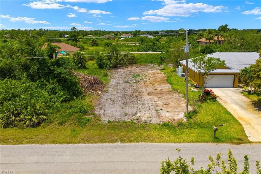A fantastic opportunity awaits you to build the custom home of your dreams on this nice-sized lot in Lehigh Acres! The adjacent .24-acre lot is also listed for sale. With both lots at your disposal, you can expand your vision to include a spacious compound for multi-generational living. Alternatively, take advantage of the additional space to create your dream home with ample room for outdoor amenities such as a pool, garden, or outdoor entertainment area. With no HOA fees to restrict your vision, the possibilities are endless. Surrounded by many beautiful homes and active new construction projects, it's clear that this area is on the rise. Another perk is that this lot boasts coveted Western exposure. Convenience is key in this fantastic location, offering an easy commute to local schools, grocery stores, shopping centers, restaurants, parks, and recreational facilities all within reach. This parcel is nestled in a quiet neighborhood off the main road, providing a peaceful retreat from the hustle and bustle of daily life. Don't miss out on the opportunity to secure the location of your new forever home or next investment property. Your blank canvas awaits!