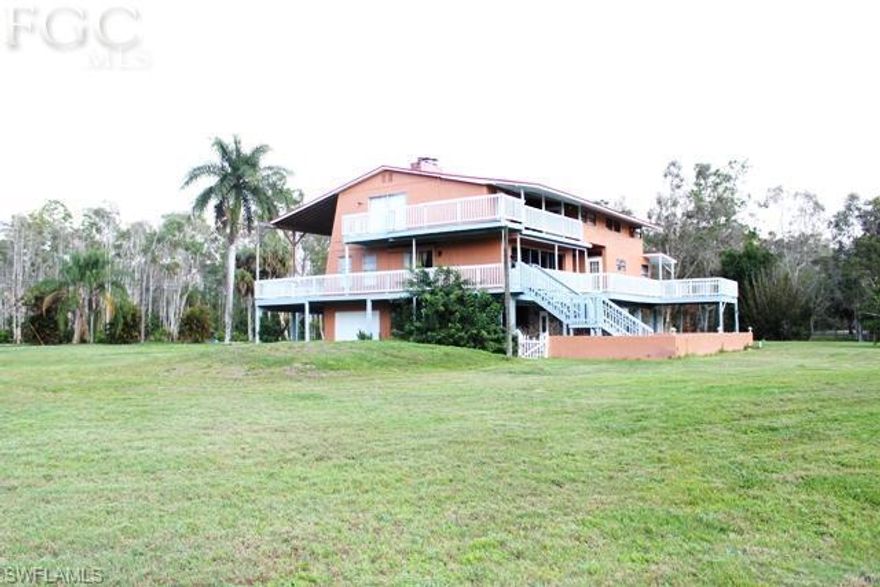 Really Neat Florida Style Pool Home located on 1 acre with 3,420 sq ft under air. This 3 Bed/2 Bath home with Den has tons of oppotunity. New Roof in 2004 and New A/C in 2012. Huge wrap around front porch that goes around the entire home perfect for entertaining. The garage holds 3 cars with additional under building parking and pass through garage door. Island kitchen, breakfast nook, 3 fireplaces, formal lving, dining and family room. CENTRALL LOCATED TO EVERYTHING: 10.25 mile/18 min.to Fort Myers Beach. 14.59 Miles/24 min. to Sanibel Island. 6.6 Miles/13 Minutes to Gulf Coast Town Center.  10.37 Miles 18 Minutes to RSW Airport