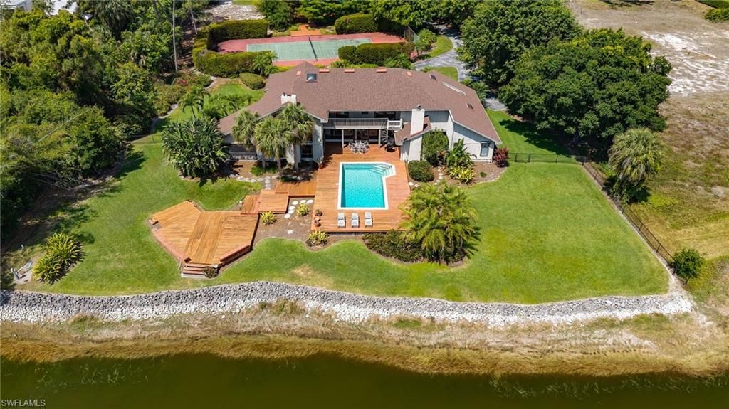 Photo of 154 Cajeput DR, NAPLES, FL 34108 (MLS # 225034376)