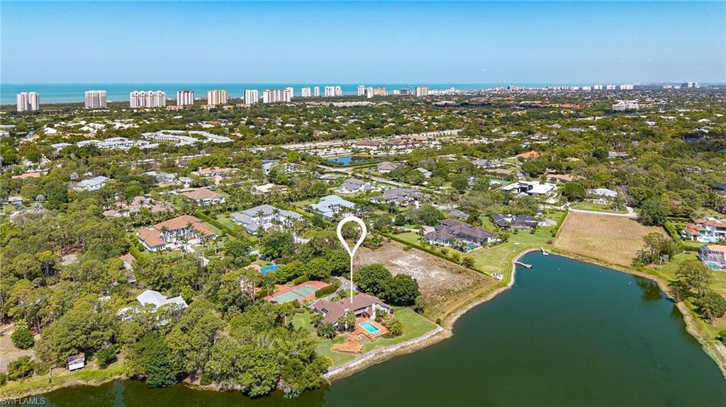 Photo of 154 Cajeput DR, NAPLES, FL 34108 (MLS # 225034376)