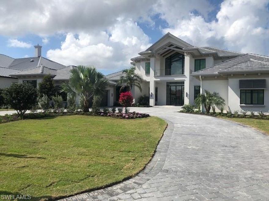 Introducing the “St. Lucia” a waterfront grand estate home by Fox Custom Homes in the exclusive neighborhood of Lugano at Miromar Lakes Beach & Golf Club. The fully furnished Florida transitional style home has 4 bedrooms, 4 bathrooms, two powder baths, pool bath, great room, study, and two 2-car garages. Square footage is 6205 under air. Outdoor living encompasses several covered conversation seating areas, a summer kitchen, and fire place. The half-acre site looks in one direction across a nearly mile long view of Lake Como and in another to a peaceful preserve. There is also a large covered balcony on the second story with multiple access points to provide outdoor living for all the 2nd floor rooms. The home allows for the utmost enjoyment of Miromar Lakes 700 acres of fresh water lakes, boating, and fishing. Deeded dock rights transfer, so you can add your private boat slip at your residence.