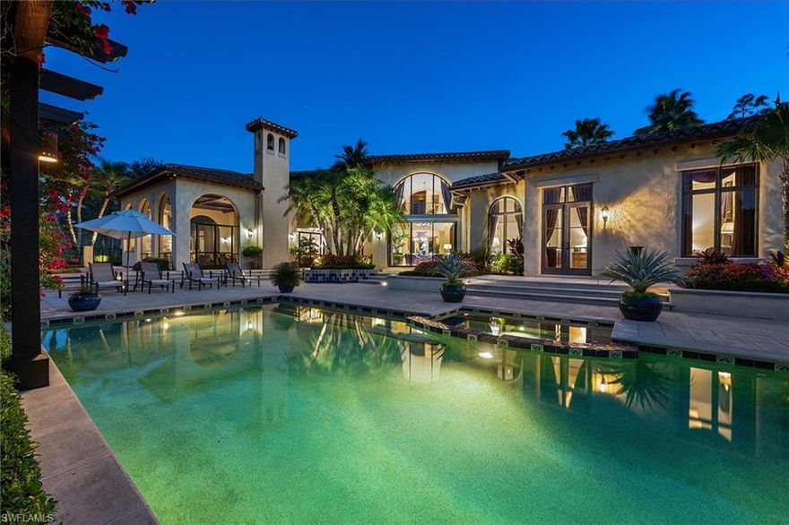 Immediate golf membership opportunity available! This custom home with its timeless details and architectural style reminiscent of the Italian countryside embodies elegance and simplicity. Perfectly situated on over an acre of land, enjoy spectacular private views over lake, golf course, and preserve. Drive through the bougainvillea-adorned porte-cochere that leads to a four-car garage motor court. Then, as you enter the home through the custom hand-scraped double doors, you are greeted by a soaring wall of glass in the two-story living room overlooking the pool. The study, with room for a spacious desk as well as additional seating, features a rich wood coffered beamed ceiling as well as French doors that lead to an intimate courtyard with vine-covered walls, that create the perfect retreat. Walk through the gallery past the walk-in wine cooler to the family room, which is flanked by the kitchen and breakfast nook on one side and opens up the expansive outdoor living area on the other. Additional features include a home theater, stone flooring, wood beam ceilings, a lighting control system and more. Truly exceptional! Located in the award-winning community of Mediterra.