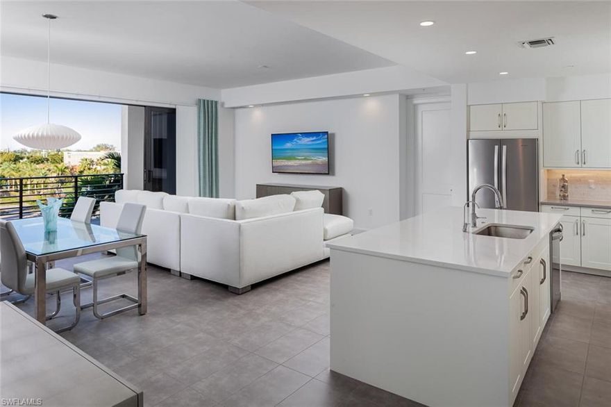 No flooding or major Hurricane Ian damage! AVAILABLE APRIL! Outstanding location in the heart of Naples within walking distance to 5th Avenue S. and close to the beach! Stunning turnkey, fourth floor 2 bedrooms + Den, 2.5 bathroom condominium with 2 garaged parking spaces. Tastefully decorated in soothing modern tones and fabulous split bedroom floor plan with a private lanai and expansive balcony overlooking the pool, bar and lounge. Both bedrooms offer en-suite bathrooms and laundry is in the unit. You’ll love the well-appointed kitchen, tile flooring throughout and the abundance of natural light. High-end amenities are a resort-style pool with lap lanes, poolside cabanas and bar, two hot tubs, bocce courts, putting green, grilling areas and fire pits with sitting area, game and billards room, theater, club room and fantastic fitness center. There is a private shuttle service to the beach and evening service to downtown Naples during season.