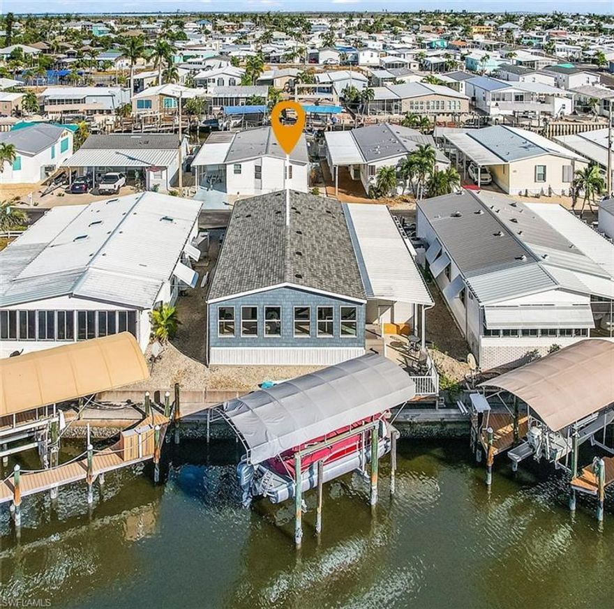 New and IMPROVED Price!!!
This 1,726 sq. ft. manufactured home on Pine Island offers 2 bedrooms, 2 baths, and a spacious open floor plan designed for effortless living. With WESTERN exposure in the backyard, you can enjoy breathtaking sunsets every evening and get the warmth from the sun throughout the winter! The WINDOW ENCLOSED, 130 sq. ft. bonus lanai features a mini-split for YEAR-ROUND comfort, extending your entertaining and relaxation space.  Enjoy sailboat access with no bridges with a deep-water canal, perfect for exploring San Carlos Bay, Pine Island Sound, and the Gulf of America. This home has NEVER flooded—even during Hurricanes Ian, Milton, or Helene. Located in St. James City, just minutes by boat from Sanibel, Captiva, Cayo Costa, North Captiva, Useppa, and Boca Grande.  This home also includes a carport and a workshop. Nestled in a charming fishing village with nearby favorites like The Waterfront Restaurant & Marina, Phuzzy’s Boat Shack, Low Key Tiki, and Woody’s Island Rum & Grill, plus golf-cart-friendly streets, this property is ideal as a full-time residence or a vacation rental. Schedule your tour today and experience the ultimate in waterfront living!
Tritoon boat is also for sale...ask for details.