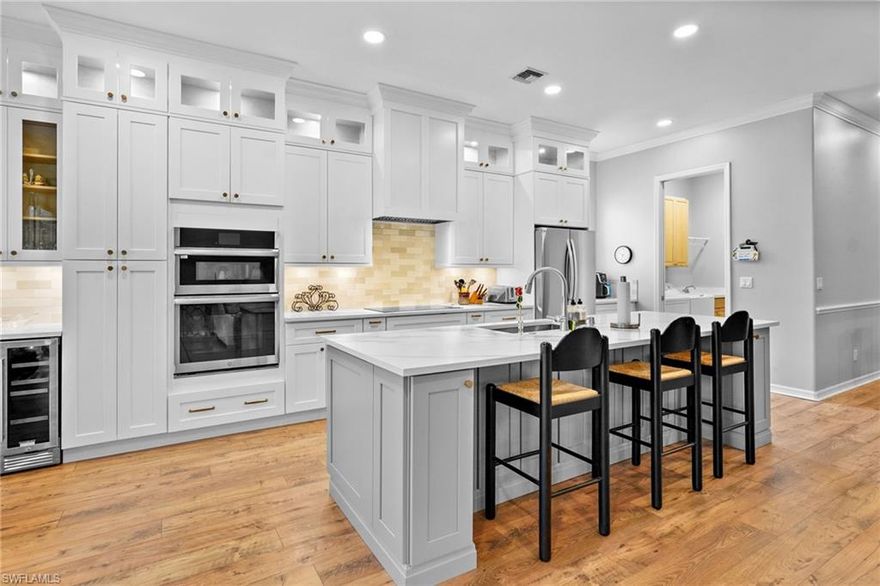 Ascot floor plan that has been completely updated with open kitchen with huge island, new cabinets, quartz counter tops, new stainless appliances, new A/C, new flooring, new roof  & new baths. This is a social membership property has a private pool and spa.  Legends Golf & Country Club is a beautiful guard gated Country Club that offers grand slam tennis, pickleball, a 35,000 square foot clubhouse with 3 restaurants, an amazing resort style pool with waterfall and spa, fitness center with free classes, tons of planned activities such as concerts, dances, card games and much more. Located conveniently in S. Ft. Myers close to shopping, restaurants, the airport and to the beaches or baseball games.