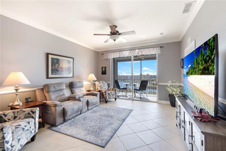 YOU WILL BE AMAZED by the PANORAMIC LAKE VIEW from this TOP (4th) FLOOR condo within the highly sought after HERITAGE POINTE community in South Fort Myers. With SOUTHERN EXPOSURE, the tiled lanai, equipped with electric StormSmart Kevlar STORM SCREENS, overlooks a large lake with lighted fountains, lake beach, amenities center, community pool, and tropically landscaped grounds. Offered TURNKEY, this two-bedroom, two-bath unit has 16” tiled flooring, set on the diagonal, throughout the living areas, kitchen, and bathrooms. The kitchen has been updated with quartz countertops, GE Profile appliances, newer fixtures, and several provisions to maximize storage including additional cabinetry, a buffet with drawers, and pullout shelving in the cabinets. Both bathrooms have been elegantly updated with glass enclosed tiled showers, granite topped vanities, and new fixtures. Other features that set this unit apart include plantation shutters, crown molding, chair rail, and taller baseboards. The HVAC system was replaced in 2022. Conveniently located just steps from the screened front entry & near the elevator is a sizeable storage unit. One deeded covered-parking space is included as well. Heritage Pointe’s comparatively low maintenance fee includes fiber optic-based high-definition TV & Internet service as well as water/sewer. Heritage Pointe is a financially sound, pet-friendly community located close to Fort Myers Beach, Sanibel/Captiva Islands, near Wakahatchee Park & Recreation center with tennis & pickleball courts, Health Park Hospital & Medical complex, pharmacies & grocery stores, shopping, restaurants, and a variety of entertainment venues. Community amenities include a recently renovated clubhouse, resort-style heated pool & spa, fitness room, library, paved walking path, plus a community gathering area featuring gas grills, and an all-purpose area for bocce ball, cornhole, and putting practice. The community offers an extensive social calendar of activities & events. Don’t miss the OPPORTUNITY to OWN THIS BEAUTIFUL CONDO in a WONDERFUL COMMUNITY – book your private showing today!