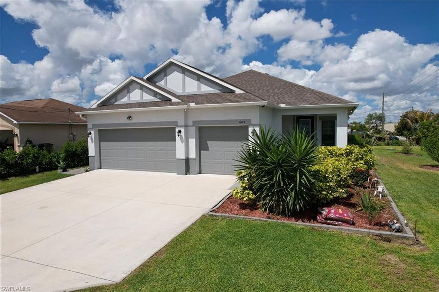 Gorgeous modern home awaits you at 605 Norman St! NOT IN THE FLOOD ZONE! Meticulously maintained and contempoary designed -this home will check all the boxes. Open floor plan with ample entertaining area will make your life easy with low maintenance. Built in 2023 this Maronda home -3 beds 2 bath has custom finishes and lots of extra storage. Large 3 car garage for all your toys.  Sit on the patio and enjoy the beautiful landscaped yard and SW Florida sunsets. This one wont last!