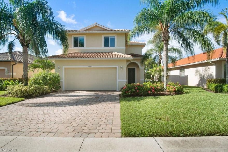 WELCOME TO VALENCIA GOLF & COUNTRY CLUB! This beautifully maintained 4 bedroom, 3 bathroom, 2,274 square foot house will make a perfect full time or vacation home! Soaring vaulted ceilings greet you as you enter this light, bright and airy modern home.  The primary bedroom features his & hers walk in closets, and ensuite with oversized soaking tub & walk in shower. The Southern rear exposure overlooks a gorgeous lake. Stainless Steel kitchen appliances installed 2021. Located only minutes from the new Founders Square shopping & dining center and the brand new 150 acre Big Corkscrew Island Regional Sports Park / Aquatic center. Valencia Golf & Country Club is a gated community with tons of amenities including a breathtaking resort-style pool and spa, and an incredible Clubhouse complete with exercise facilities, billiards room, card room, library, kitchen, and movie theater room. The newly renovated 18 Hole Public Golf course with Driving Range, Pro Shop & Patio Bar offers variety of optional memberships, as well as pay-as-you-play (Golf Memberships are not mandatory). Best value in North Naples - this home won’t last long!