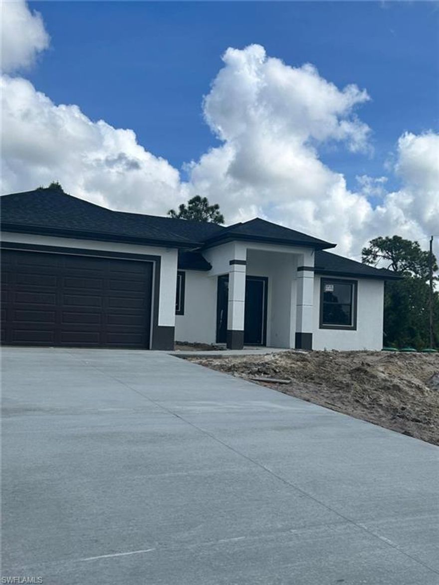 Welcome to this stunning NEW CONSTRUCTION home in the fast-growing Lehigh Acres area! Designed with modern living in mind, this property features an open-concept layout, high ceilings, and stylish finishes throughout. The gourmet kitchen boasts quartz countertops, stainless steel appliances, and ample cabinet space. The spacious master suite offers a walk-in closet and a beautifully designed bathroom with dual sinks. Enjoy outdoor living with a large backyard—perfect for a future pool or entertaining. No HOA and plenty of space for your toys! A perfect opportunity to own a brand-new home in Southwest Florida. NEW PICTURES SOON