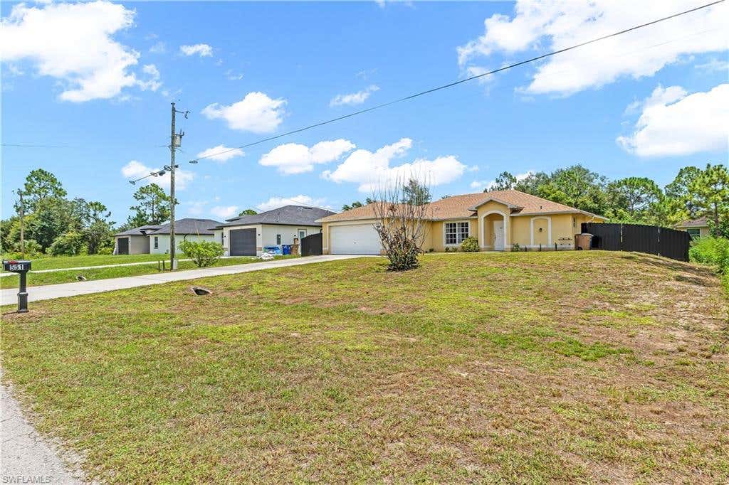 Photo of 551 Eisenhower BLVD, LEHIGH ACRES, FL 33974 (MLS # 226027669)
