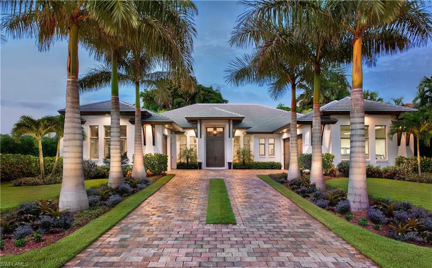 Gracious, architecturally inspired, British West Indies smart estate home located west of Crayton Rd, steps from Moorings Private Beach. Every detail of this masterfully built, open concept floor plan home (5 BR, 5 full and 2 half bath, Gym, 2 car garage) by Falcon Design and Knauf-Koenig Group will impress you. The great room's large, floor to ceiling transom windows, soaring ceilings, beautiful and extensive wood trim detail, and wide plank washed oak floors are perfectly finished. The master suite delivers on every level - spacious, gorgeous, and private. Fours en-suite guest bedrooms offer luxurious accommodations for family and friends. After all that, this homes crowning achievement is the outdoor great room, large backyard, the focal point of an amazing outdoor living space, complete with covered cabana, outdoor kitchen, outdoor shower, stone fireplace, TV, a beautiful pool/spa with stepping stones and sun shelf, and spacious, lushly landscaped, private backyard. Security system, prewired for sound, mosquito misting system, landscape lighting, remote controlled screens and shutters on the lanai - every upgrade imaginable!