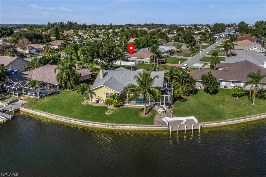 LAKEFRONT home with amazing SUNRISE views over the Lake Kennedy, and great central location close to restaurants and shopping. This beautiful home has it all and comes turnkey - move-in ready or rewarding, enjoyable investment opportunity! You will enjoy a South-Eastern Exposure that will boast stunning sunrise views, but also spoils you with plenty of sun during the day. The oversized lot gives you a lot of privacy in a quiet neighborhood, close to shopping, dining and entertainment. You can enjoy a private pool, fireplace, formal dining, high ceiling in the great room, many windows and a private den. Wonderful landscaped with cement curbing, rock stones, and beautiful palm trees. Book your private showing today! Home comes with a One-Year Home Warranty!