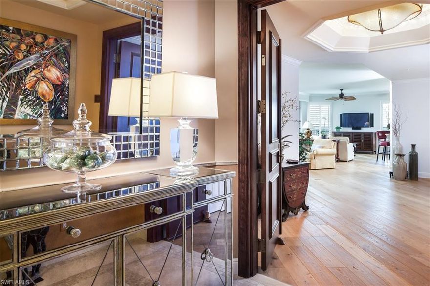 Welcome to Treviso at The Colony Golf and Bay Club where you can enjoy breathtaking sunsets over stunning views of the Estero Bay and Gulf of Mexico from the eighth floor. Beauty and comfort meet in this newly renovated condominium with over 3,000 square feet of spacious luxury living. Step off your secured elevator into a welcoming home with natural light and endless elegance. Entertain your guest in this open and bright kitchen with a neutral palette of granite counters, wood paneled appliances, wrap around breakfast bar, island, and double ovens. The master suite boasts two large walk in closets, luxurious master bath with soaking tub, separate shower, dual sinks, bidet and marble counters. Luxury living includes marble, custom wide plank wood flooring, fireplace, formal dining area, floor to ceiling sliding glass doors, electric shutters and terraces from every room. Treviso at The Colony Golf and Bay Club offers a resort style pool & spa with social pavilion, beautiful secured lobby, state of the art theater, fitness center, social room with bar and billiards, board room, and two large guest suites. This is a must see! Condo includes two garaged parking spaces.