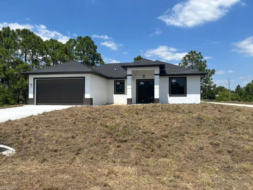 Brand-new construction located in a rapidly growing area of Lehigh Acres! This beautiful home offers a modern open-concept floor plan with abundant natural light and quality finishes throughout. The kitchen features sleek cabinetry, stainless steel appliances, and a spacious island perfect for entertaining. Enjoy generously sized bedrooms, a comfortable master suite, and elegant bathrooms designed for everyday living. Situated on a spacious lot with plenty of room for a pool, RV, or boat, this property combines style, functionality, and Florida lifestyle living. Conveniently located near major roads, shopping, and dining. NEW PICTURES SOON