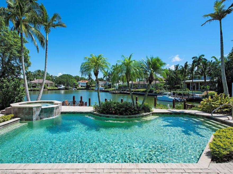 H.12043 NO BRIDGES between you and the Gulf of Mexico in one of Naples’ finest waterfront communities! Dock your 50’ boat at the base of your pool. This beautiful 4 bedroom plus den, 5 bath waterfront estate home provides panoramic views overlooking a resort style pool, spa and boat docked on picturesque Bowline Bay. Entertain formally in the spacious formal living room or casually in the well-appointed kitchen, family room and sensational outdoor living area beneath the large covered lanai. The owner’s master suite is on the first floor and features plenty of closet space, a huge master bath with dual sinks, soaking tub and walk-in shower. A guest suite on the opposite side of the home plus two more guest suites upstairs afford ample space for your guests. Walk to Naples’ pristine white sugary sand beaches for incredible sunsets or take a short drive to Old Naples for world-class shopping, dining, and theater on internationally acclaimed 5th Ave S. or 3rd Street S. Venetian Village, Waterside Shops and Mercato are a short drive away. Finally, experience the serene calm at night relaxing on your covered lanai overlooking the lit pool, spa, reflecting sparkling lights on the bay.