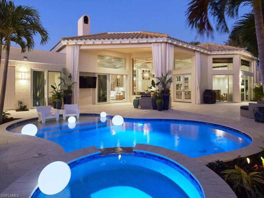 This exquisite villa, masterfully renovated in 2023 by The Glendale Group of SWFL, is a highly desirable single-story detached residence located in the prestigious community of Grand Bay at Pelican Bay. The property boasts captivating golf course and lake views, offering a serene and picturesque setting. The villa features an impressive 3,146 square feet of living space under air, with a total of 4,087 square feet under roof. The extensive renovations include all new: plumbing, electrical, flooring, appliances, countertops, and cabinetry.  This thoughtfully designed floor plan includes 3 bedrooms, 4 baths, a family room, living room, morning room, and a spacious eat-in kitchen. Additionally, the home offers a den-study, a custom built-in wet bar, a spacious courtyard, and a lanai, providing ample space for both relaxation and entertainment. One of the standout features of this property is its highly coveted open-concept floor plan, which allows for a natural flow between the foyer, living room, family room, and kitchen. This design creates a seamless and inviting living space, perfect for modern lifestyles. The villa's eastern rear exposure is a notable feature, allowing beautiful morning light to flood the main living areas, creating a warm and inviting atmosphere throughout the day. The master suite is a true retreat, offering patio access, two spacious walk-in closets, and a luxurious master bath. The bathroom features dual vanities, a spacious walk-in shower, and a large built-in soaking tub, providing a spa-like experience in the comfort of your own home. A unique aspect of this property is the inclusion of a 1-bedroom en-suite casita, privately situated away from the main home. This feature offers versatility for accommodating guests, creating a home office, or serving as a private retreat. This meticulously renovated villa in Grand Bay at Pelican Bay combines luxury, functionality, and stunning views, making it an exceptional residence in one of Naples' most sought-after communities. Pelican Bay offers an exceptional lifestyle with nearly 3 miles of private white sand beaches, beachfront dining options like Marker 36 restaurant, and abundant recreational opportunities across its 570 acres of mangroves and estuaries. Residents enjoy 18 Har-Tru tennis courts, pickleball courts, parks, walking trails, sailing, and kayaking through scenic waterways. This exquisite property on a quiet street in Pelican Bay is the ultimate sanctuary for those seeking elegance, comfort, and convenience in this premier community.