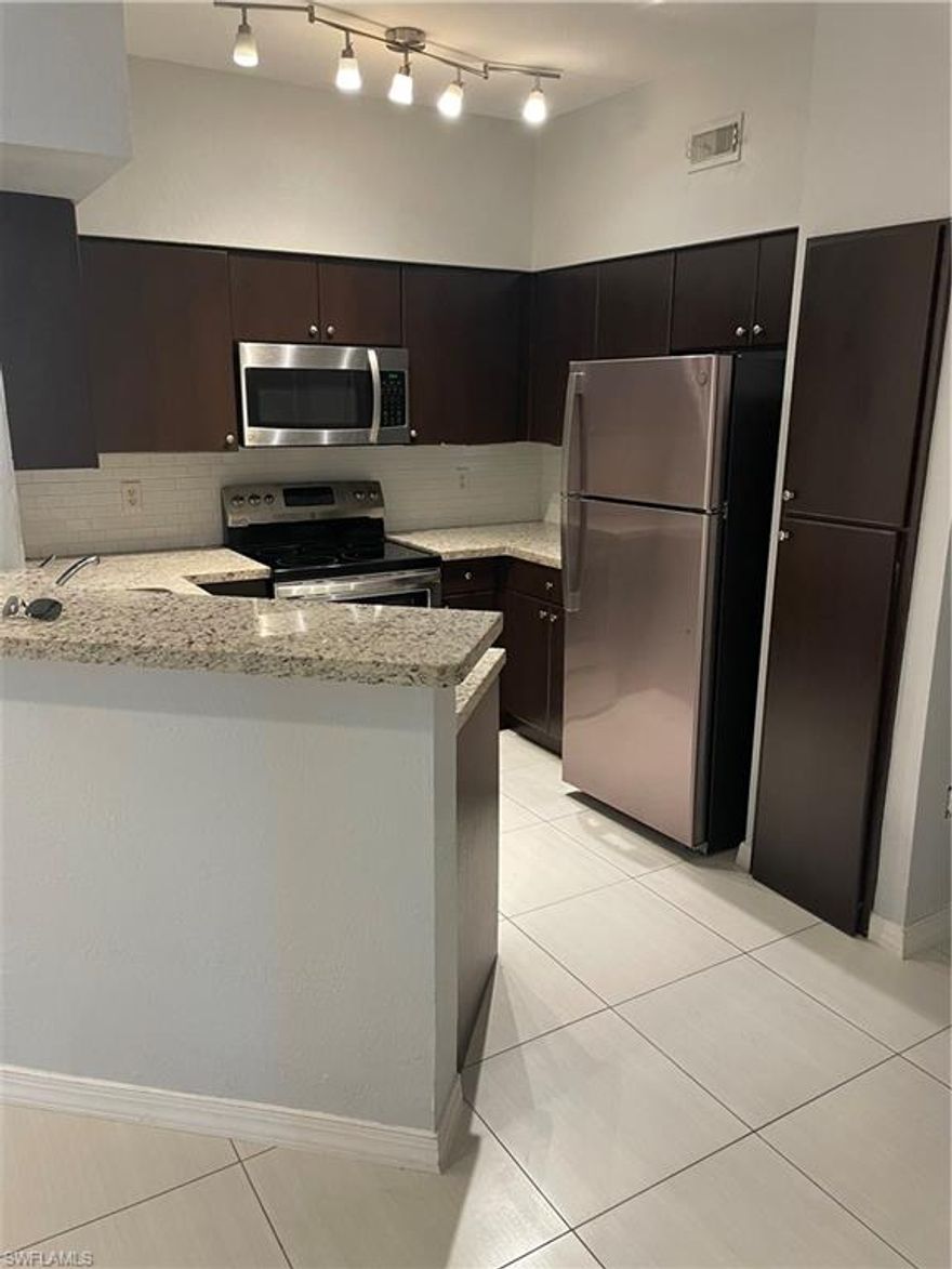 Welcome to this exquisite 2-bedroom, 2-bathroom condominium. Meticulously designed with a keen eye for detail, this residence has undergone renovations that are sure to captivate. This modern kitchen boasts stunning granite countertops, rich wood cabinets, and stainless steel appliances. Both bathrooms have been adorned with tasteful tile work in the showers. Location is everything, and this property is ideally situated near the prestigious Hyatt Hotel and Resort, Coconut Point Mall, and the Hertz world headquarters. Easy access to I-75 ensures that you can effortlessly explore all that the region has to offer. For jet-setters, the SWFL International Airport is just a stone's throw away, making your travels convenient and stress-free. Embrace the beauty, convenience, and sophistication that this condo offers. Welcome to your new sanctuary, where every day feels like a vacation. This property is part of a probated and the sale must be approved by the court.