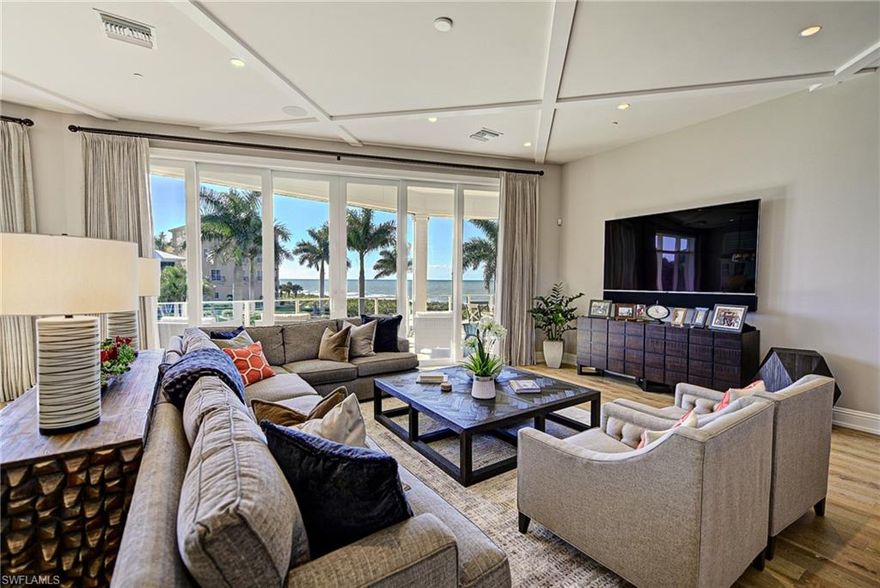 Stunning custom beach home.  This luxury residence is situated on a lot and a third.  Features direct SW exposure Gulf front lot in the largest of all the Barefoot Beach gardens. This 4-Story home offers a wide open feel on all levels due to the high quality of construction and has been professionally appointed top to bottom in an elegant coastal style. Layout includes 6 bed suites, his and her office space, top level cloud entertaining, and beach living and bar with 9 total baths. Includes grand wood staircase, elevator, high end gas appliances, electric screens, tasteful wide plank oak flooring, and large sit up butcher block kitchen island. Home also includes gas generator. Concrete and impact glass construction. Smart home lighting and numerous wet bars throughout. Includes garden heated pool, landscaped beach grounds, beach boardwalk, private clubhouse with fitness, tennis, and pickle ball. 24 hour patrolled security. Closest beach to international airport convenient to both Coconut Point and Naples entertainment.