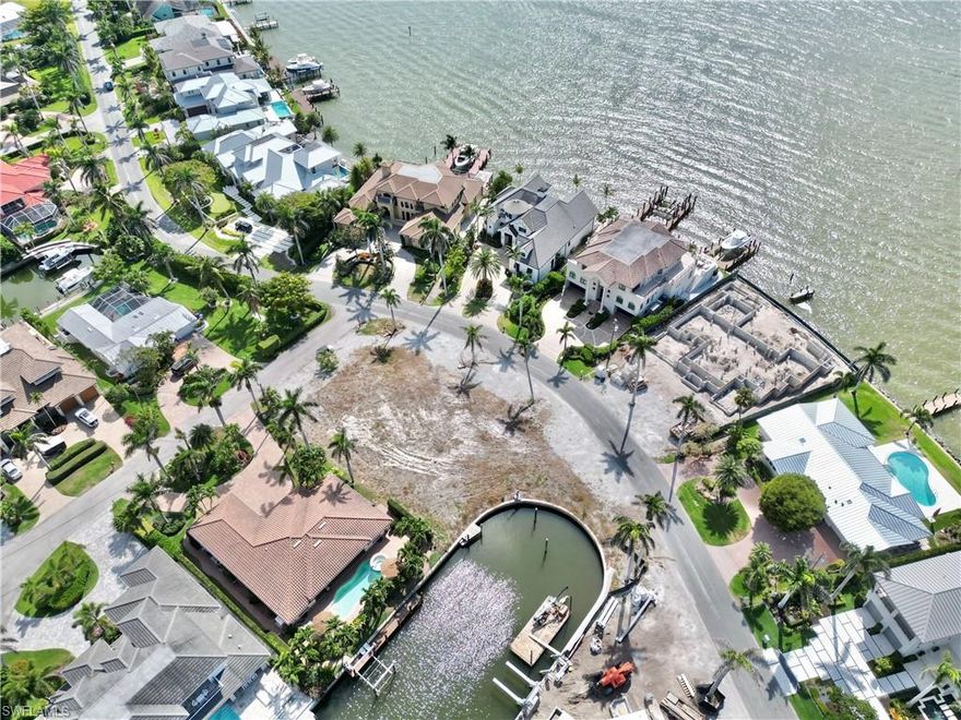 L7185  Don't miss out on the chance to build your dream home in the sought-after Royal Harbor boating community! This .34-acre lot offers stunning east/west exposure and comes equipped with your own private dock for easy access to the Gulf. Imagine enjoying breathtaking sunset views from your very own rooftop bar overlooking the bay. As a boater's paradise, Royal Harbor boasts direct access to the Gulf with no bridges to navigate. Plus, its prime location just minutes from Naples' famous 5th Avenue shops, restaurants, and pristine beaches means you can immerse yourself in the Naples lifestyle without sacrificing convenience. With easy access to all the fun activities and events that downtown Naples has to offer year-round, this lot offers the perfect opportunity to create your own slice of paradise in this vibrant community.