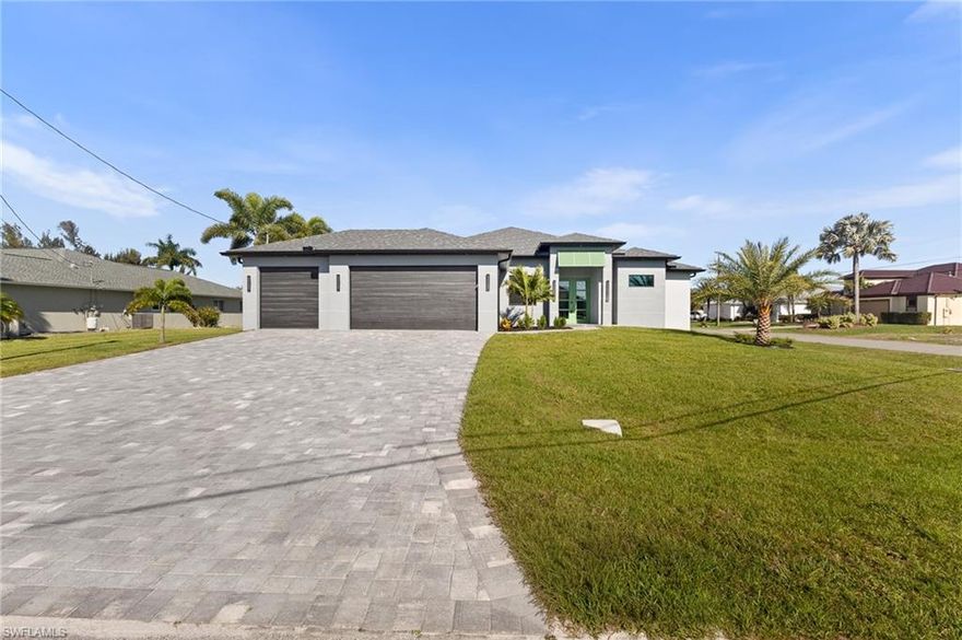 Stunning modern residence featuring an open-concept design and high-end finishes throughout. This beautifully crafted home offers abundant natural light with expansive windows and a seamless flow between living, dining, and kitchen areas—perfect for both everyday living and entertaining.
The kitchen is thoughtfully designed with sleek cabinetry, modern fixtures, and premium finishes, creating a sophisticated yet functional space. Spacious bedrooms and spa-inspired bathrooms provide comfort and elegance, including a luxurious primary suite.
Step outside to your private outdoor oasis featuring a screened-in lanai and a gorgeous pool area—ideal for relaxing or hosting gatherings year-round. The covered patio adds additional living space, perfect for enjoying Florida living at its best.
Located in one of the most desirable areas of Cape Coral, this home offers a spectacular location just minutes from the highly anticipated Seven Islands development, adding tremendous future value and lifestyle appeal.
NO FLOOD INSURANCE REQUIRED! The property has a LOMA certificate on file, offering significant savings for the future homeowner.