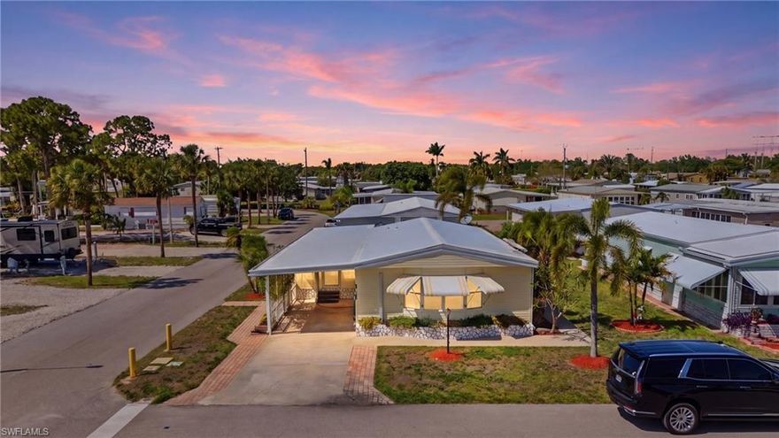 Welcome to the highly sought-after co-op community of Imperial Bonita Estates, where vibrant 55+ living meets true neighborhood charm. From the moment you enter, you’ll feel the warmth of this active community, neighbors out enjoying the day, friendly waves as you pass by, and a lifestyle that’s both social and inviting.

Perfectly positioned on a corner lot and just moments from the community amenities, this home offers both convenience and a prime location within the neighborhood. As you arrive, the covered carport and enclosed Florida Room welcome you in an ideal space to relax, unwind, or greet guests before stepping inside.

The interior opens to a bright and airy great room, dining area, and kitchen, creating a seamless open-concept layout that’s perfect for entertaining. Whether hosting friends or enjoying quiet evenings at home, this space is designed for easy, comfortable living.

Both bedrooms are generously sized with ample storage, offering flexibility for guests, hobbies, or simply spreading out. The home also features a large storage area with in-residence laundry, adding to the practicality and ease of everyday living.

Step outside and you’ll find one of the true highlights of the home is a beautifully pavered patio with a charming tiki hut, creating your own private outdoor retreat. It’s the perfect setting for afternoon gatherings, evening cocktails, or simply enjoying the Florida lifestyle year-round.

This community truly elevates the experience with a brand-new resort-style pool, kayak launch/boat ramp, shuffleboard courts, and a clubhouse filled with amenities and social activities, offering endless opportunities to stay active and connected.

Ideally located just minutes from Bonita Springs’ white sandy beaches and a short drive to Southwest Florida International Airport, you’ll enjoy both relaxation and convenience right at your fingertips.

If you’ve been searching for a home that combines location, lifestyle, and entertaining space, this one checks all the boxes.

Schedule your private showing today, this is one you won’t want to miss.