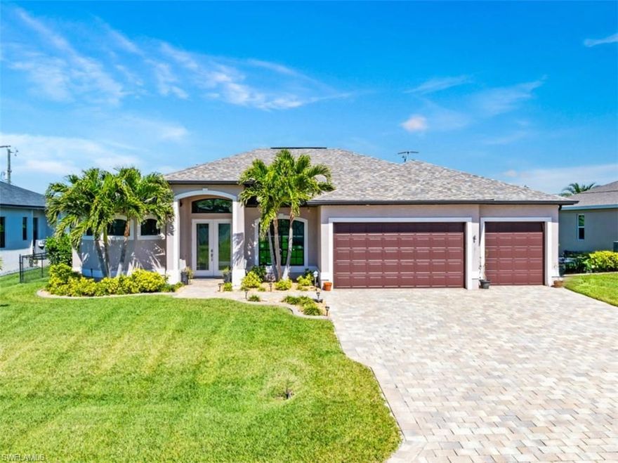Stunning Pool Home in Prime SW Cape Coral Location!

Prepare to be impressed by this beautifully upgraded pool home, perfectly situated in a desirable SW Cape Coral neighborhood! Enjoy the convenience of nearby shopping, dining, top-rated schools, golf courses, and medical facilities—all while living across from stunning Gulf-access homes.

Step inside and be greeted by soaring ceilings with elegant tray details, an expansive open-concept layout, and a gourmet kitchen designed to impress. Featuring a huge breakfast bar, granite countertops, 42” wood cabinetry, and abundant storage, this kitchen seamlessly overlooks the spacious living and dining areas. From here, sliding glass doors lead to the oversized screened lanai, showcasing the views of the heated pool.

This home boasts impact-resistant windows and doors, ensuring both security and energy efficiency. The spacious primary suite is a true retreat, complete with crown molding, dual walk-in closets, a large linen closet, and private access to the lanai. The luxurious primary bath features a walk-through shower with body jets, dual vanities, and a soaking tub, creating a spa-like experience.

Designed for relaxation and entertaining, the outdoor space includes a resort-style pool with a waterfall and deck jets and a full outdoor kitchen. A privacy fence and mature landscaping provide seclusion, making this backyard a perfect oasis. The split-bedroom layout offers two guest rooms, one of which includes a full ensuite bath that also serves as the pool bath. A dedicated office space off the entry and living area provides flexibility for remote work or a quiet retreat.

Additional features include a spacious laundry room conveniently located off the three-car garage, which is finished with durable epoxy flooring and provides plenty of storage space. Built in 2017, this home is packed with premium upgrades, including tile flooring laid on the diagonal, a paver driveway and pool deck, air and water purification systems, a custom front entry door, and a picture-window pool cage. The heated pool operates with both electric and solar options for year-round enjoyment. City utilities in and assessments paid!  With a freshly painted interior in 2023, this home is truly move-in ready—just bring your bags and start living the Florida dream!  Furniture is negotiable. Seller will consider owner financing - ask your agent about terms!