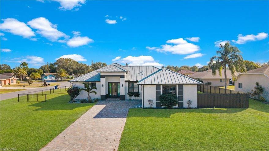 Welcome to 24 Crestwood Circle S in Lehigh Acres, Florida, a stunning newly constructed luxury home designed for refined Florida living. Situated on a desirable corner lot, this property is fully fenced all around for privacy and security and is connected to city water. A sleek, durable metal roof adds both modern style and long-term peace of mind.

Inside, the home showcases elegant porcelain flooring throughout and soaring high ceilings that create a bright, open, and sophisticated atmosphere. The thoughtfully designed layout offers seamless living and entertaining spaces finished with luxury details throughout, blending comfort with contemporary design. The spacious kitchen and living areas are filled with natural light, while the bedrooms provide a serene retreat with refined finishes.

Step outside to a generous yard with ample space for outdoor living, pets, or future enhancements. Located close to schools, shopping, dining, and major roadways, this exceptional residence offers the perfect balance of luxury, privacy, and convenience. This newly constructed home can be yours—a rare opportunity to own a high-end property in one of Southwest Florida’s growing communities.
