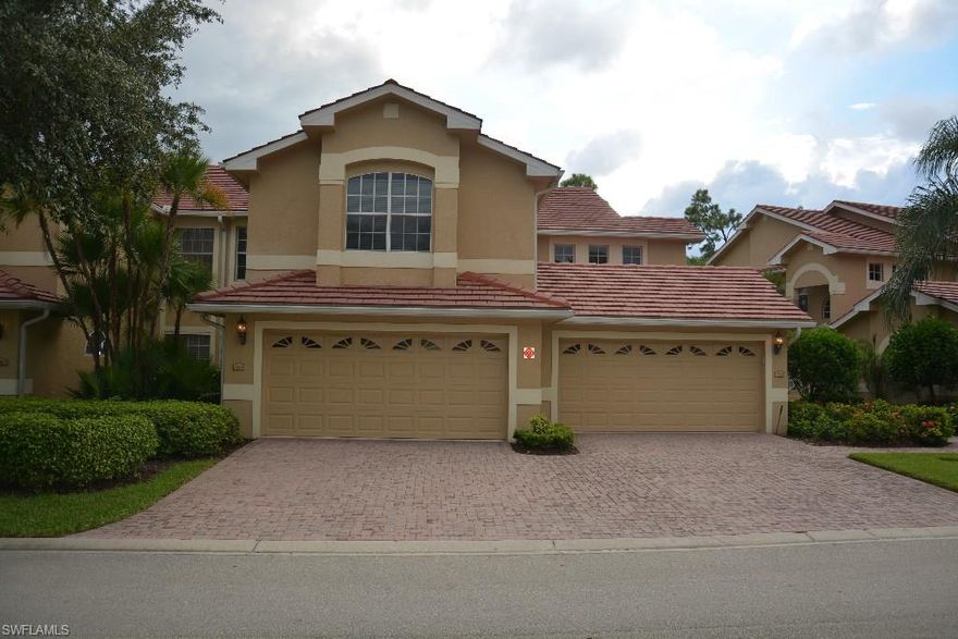 Rarely offered first floor coach home with 2 car garage has a  gorgeous view of the 11th fairway with fabulous sunsets. The updated kitchen is outstanding: featuring white wood cabinets, granite countertop, tumbled marble backsplash, and stainless steel appliances. Freshly painted with designer colors, this unit is light and bright with upgrades galore. AC and water heater have been replaced, Home-Tech Gold Plan conveys. Plantation shutters on all windows and tile in main areas. Electric hurricane shutters on the lanai and additional hurricane shutters for all the windows. Grandezza is minutes from exceptional shopping, restaurants, and the RSW airport. Everyone is a social member at the 53,000 sq ft clubhouse which overlooks a resort style pool with an outside bar and food service. Golfers and tennis players have several membership options to enjoy. Living in Grandezza is living the grand life.
