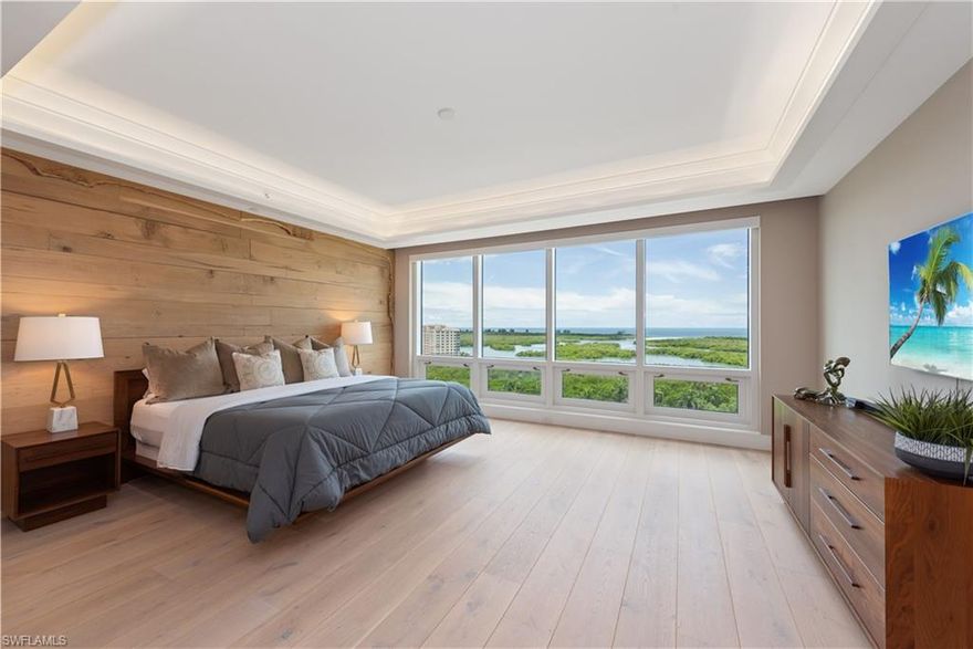 A striking 4bdrm residence with a mid-century modern feel. Located in Kalea Bay, this 12th-floor end unit gives the optimal view of miles of aqua waters & natural landscape. Enjoy dramatic sunsets on your open lanai & the full-length windows. Over 3200 sqft with an expansive floor plan w/a focus on natural materials, beamed ceiling and custom built-ins.  Private elevator foyer, w/ wood surrounding mirror is a stunning focal point. The master bedroom has a wood wall detail that is the perfect backdrop for this incredible master suite. All the wood within the unit (Hickory, Cherry & Oak) including the live edge shelves in the foyer was chosen from the Seller’s northern property. The kitchen is a chef’s dream, including Wolf gas cooktop, a large island, and Subzero appliances, a butlers pantry, and LED lighting throughout. Many originally designed custom details are showcased throughout the unit. Kalea Bay T100 boasts a rooftop pool, open-air fitness area and lounge. The Club At Kalea Bay has 2 restaurants, 3 additional pools, an active tennis and pickleball program, state of the art fitness center and guest cottages. A five star resort in your own backyard.