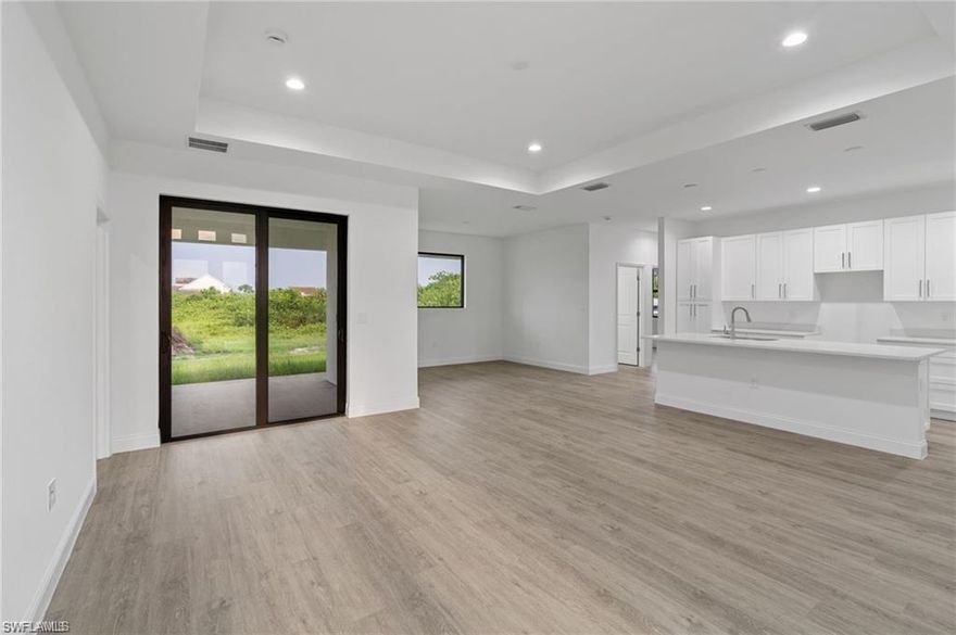 Ready to move in! Unique opportunity to own a brand new construction home in Southwest Florida. This spacious 3 Bed / 2.5 Bath + Den house offers 1,892 square feet of living area and an approximate total area of 2,791 square feet. Situated on a corner lot in a quiet corner of Lehigh Acres, this home boasts an excellent location close to elementary schools, retail, restaurants, and main streets. The kitchen is a chef's delight with sparkling white quartz countertops and high 42-inch white cabinets, complemented by stainless steel Whirlpool appliances, including an Energy Star certified dishwasher with Sensor Cycle. The second bathroom conveniently offers access from the lanai, perfect for outdoor entertaining. This home is one of the few in the area featuring a half bathroom for guests and a versatile den, ideal for a home office or playroom. Seller concessions are provided to make this dream home even more attainable! Don’t miss out on this fantastic opportunity!