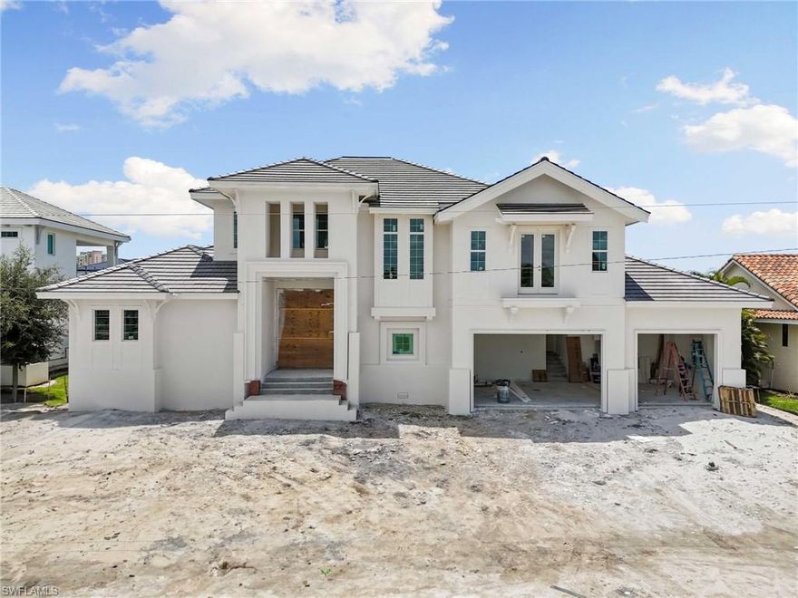 Look no further—paradise is calling. Crafted by the renowned Frey & Son Homes, this stunning new construction is set for completion in mid - January 2026 and perfectly positioned just 0.6 miles from Marco Island’s iconic crescent beach, with easy access to fine dining, boutique shopping, and local entertainment. Designed for both relaxation and entertaining, the home features a spacious open-concept main level and a second-floor family room—ideal for hosting friends, extended family, or guests. A variety of custom design options are available upon request, allowing you to tailor this home to your exact vision. Whether you’re seeking a personal island retreat or a high-end vacation rental, this property offers exceptional value and timeless coastal charm. For boating enthusiasts, enjoy direct Gulf access with no bridges, a new seawall (2023), and 100 feet of water frontage—plenty of room to build the dock of your dreams. Positioned perfectly with a west-southwest exposure, you’ll take in breathtaking sunset views right from your private lanai. Picture this: a carefree day at the beach, appetizers at your favorite waterfront spot, and a sunset cruise to end the evening—all from the comfort of your own Marco Island paradise.